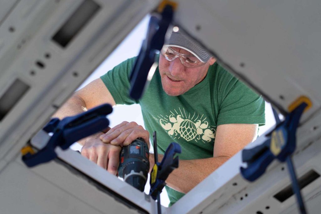 Installing MaxxFan fans in a camper van, attaching fan adapter to the install kit