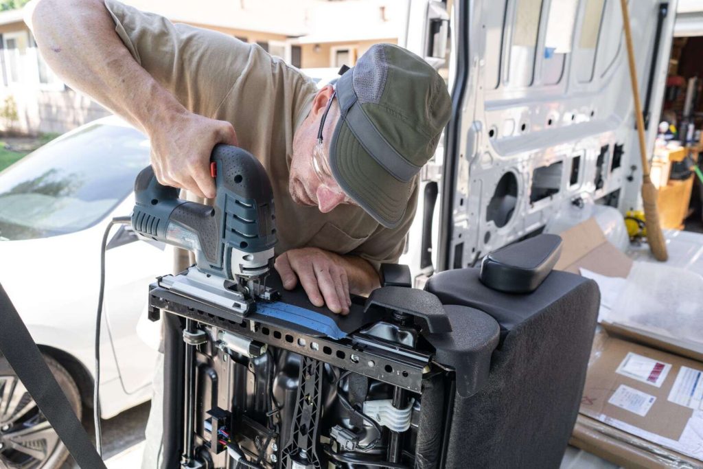 Ford Transit swivel seat installation, trimming black plastic panel