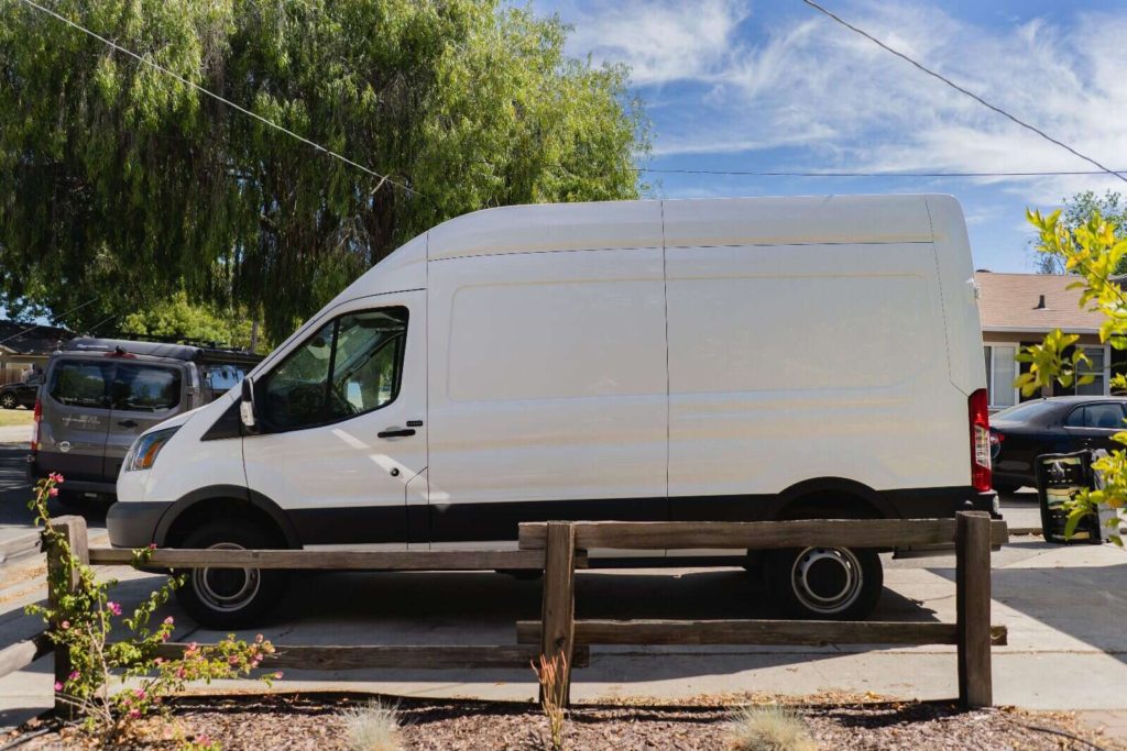 Ford Transit cargo van exterior driver's side, before window installation.