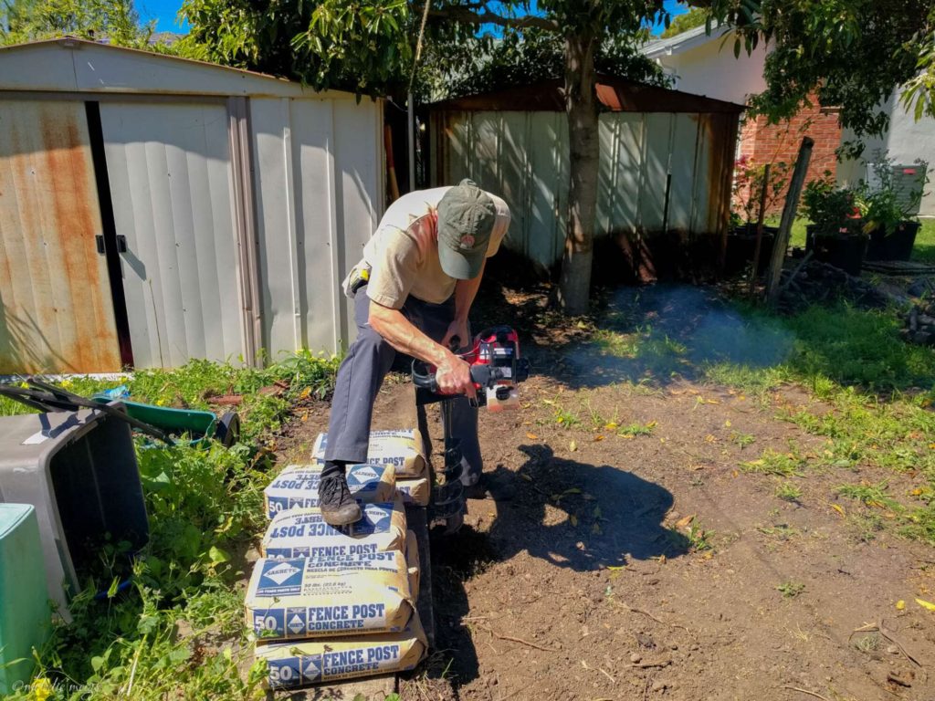 installing modern good neighbor fence auger