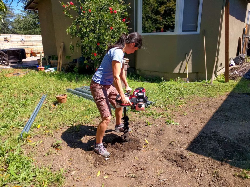 installing modern good neighbor fence auger